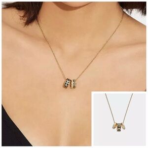 NWT Coach Signature Enamel Rondell Gold and Black Pendant Necklace